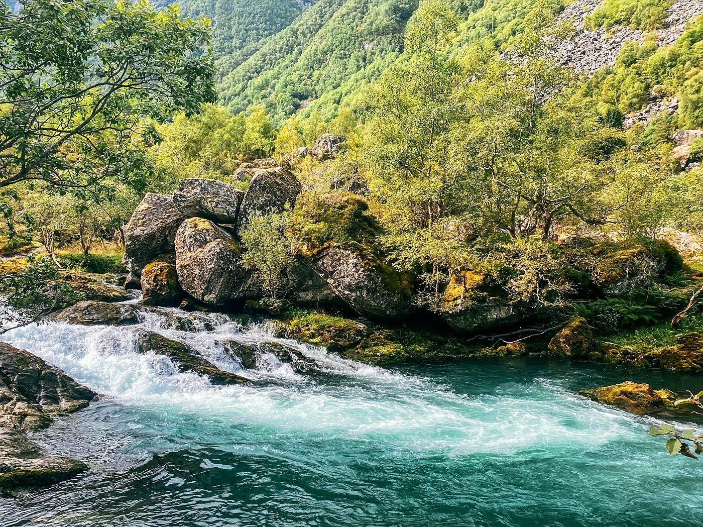 Turquoise glacial river in Folgefonna National Park near Bergen